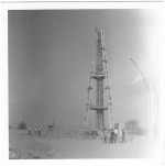 Photo of the Seattle Space Needle being constructed on a dusty lot